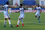 Pune's players celebrate Raju Gaikwad's own goal